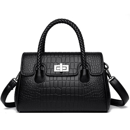 Embossed handbag with turn-lock closure