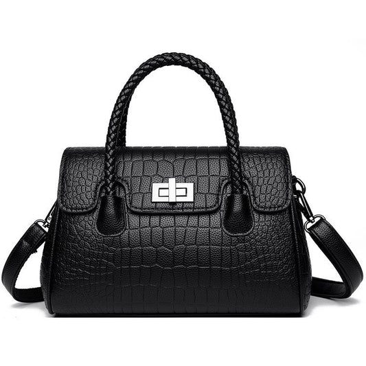 Embossed handbag with turn-lock closure