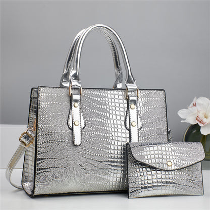 Embossed handbag with matching pouch