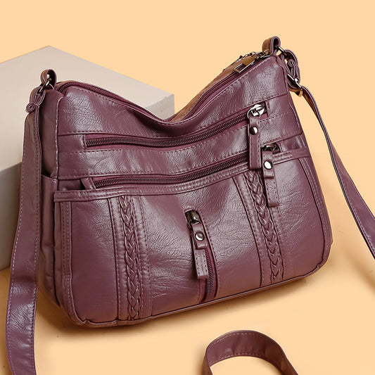 Multi-pocket shoulder bag with zipper closure