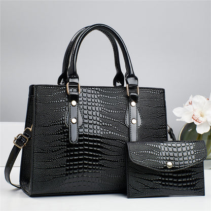 Embossed handbag with matching pouch