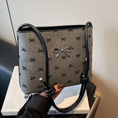 Structured handbag with perforated surface