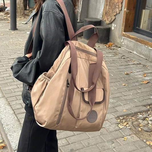 Soft backpack with flap and drawstring closure