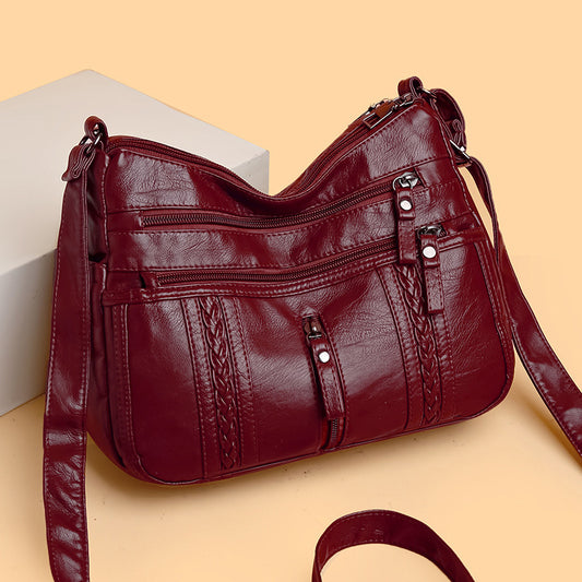 Multi-pocket shoulder bag with zipper closure
