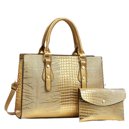 Embossed handbag with matching pouch