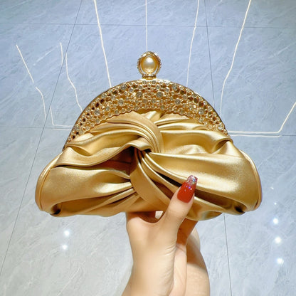 Satin clutch bag with metal frame