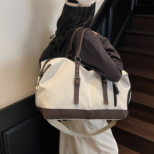 Canvas duffel bag with leather accents