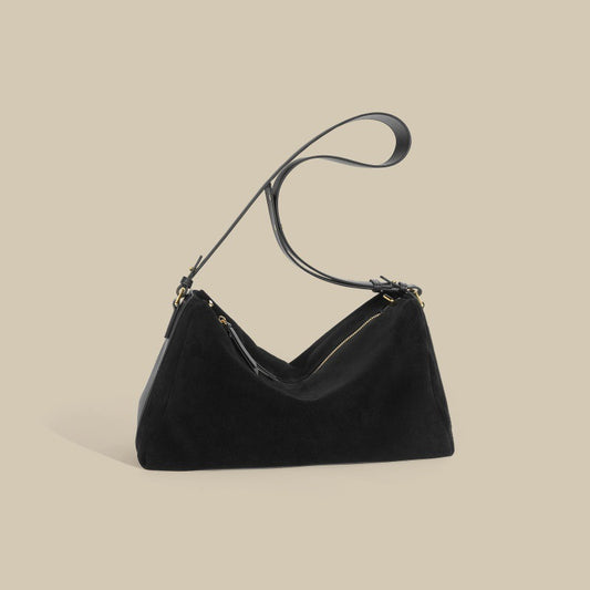 Triangular handbag with single handle