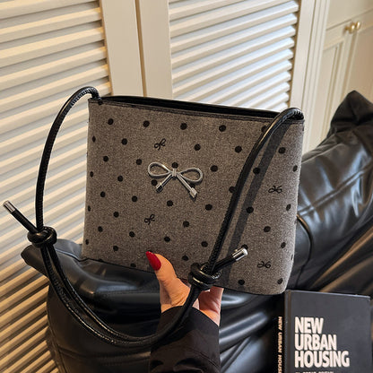 Structured handbag with perforated surface