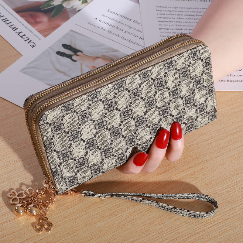 Patterned zip-around wallet with wrist strap