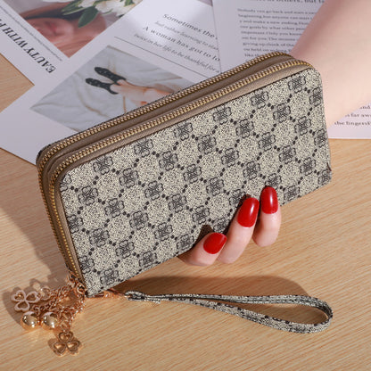 Patterned zip-around wallet with wrist strap