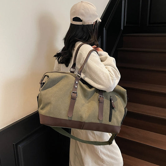 Canvas duffel bag with leather accents