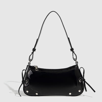 Glossy shoulder bag with side ties