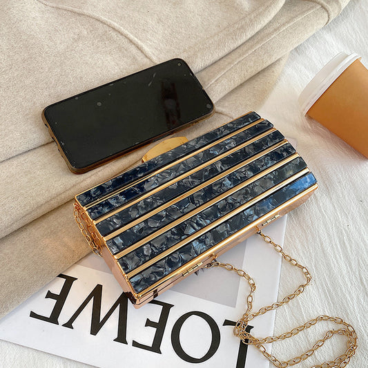 Rhinestone embellished clutch bag with chain strap
