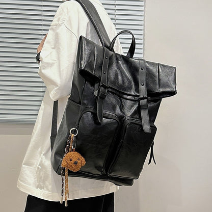 Fold-over flap backpack with front pocket