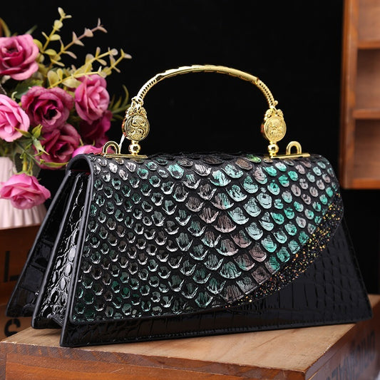 Structured handbag with metallic handle
