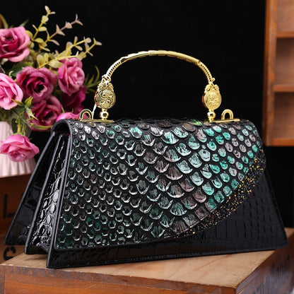 Structured handbag with metallic handle