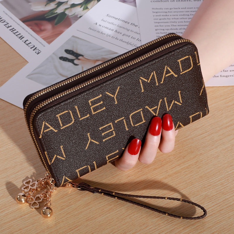 Patterned zip-around wallet with wrist strap