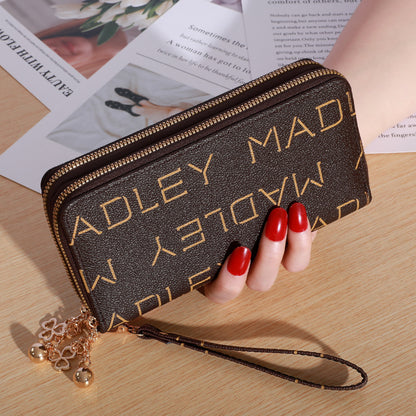 Patterned zip-around wallet with wrist strap