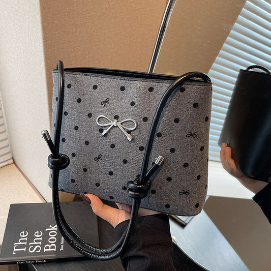 Structured handbag with perforated surface