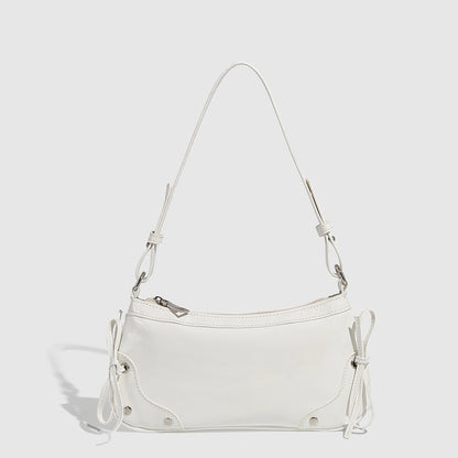 Glossy shoulder bag with side ties