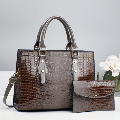 Embossed handbag with matching pouch