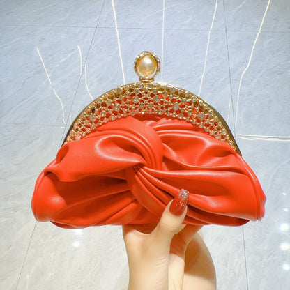 Satin clutch bag with metal frame