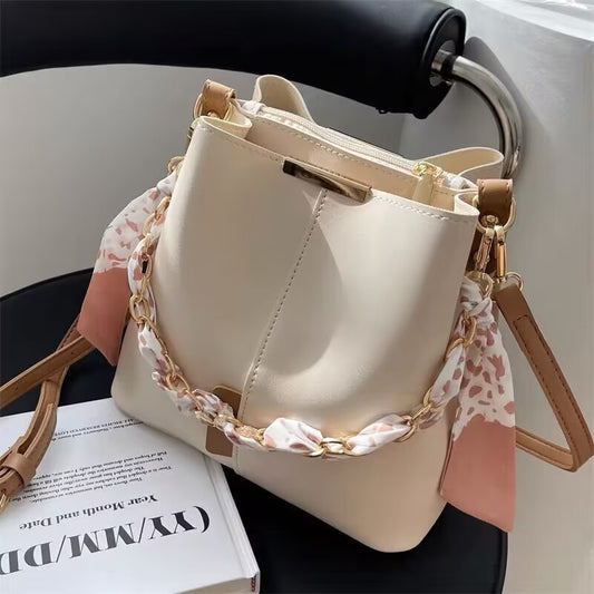 Bucket bag with fabric handle detail