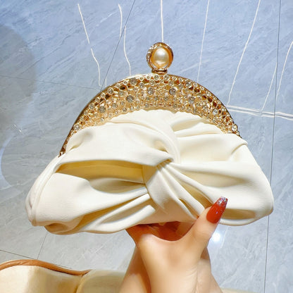 Satin clutch bag with metal frame