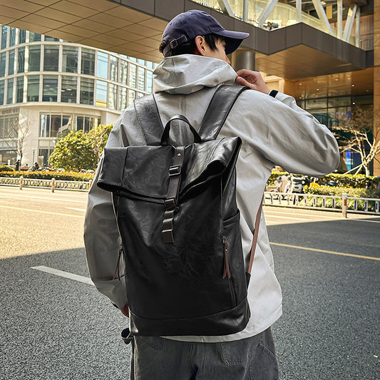 Fold-over leather-look backpack with buckle strap