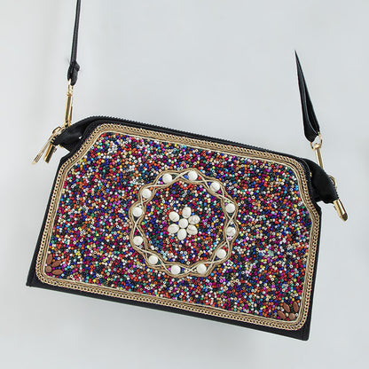 Embroidered crossbody bag with embellishments