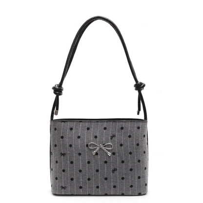 Structured handbag with perforated surface