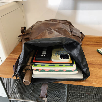 Fold-over leather-look backpack with buckle strap