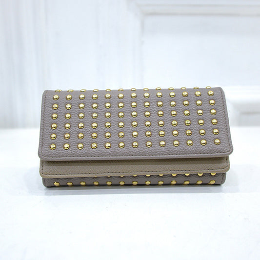 Studded wallet with flap closure