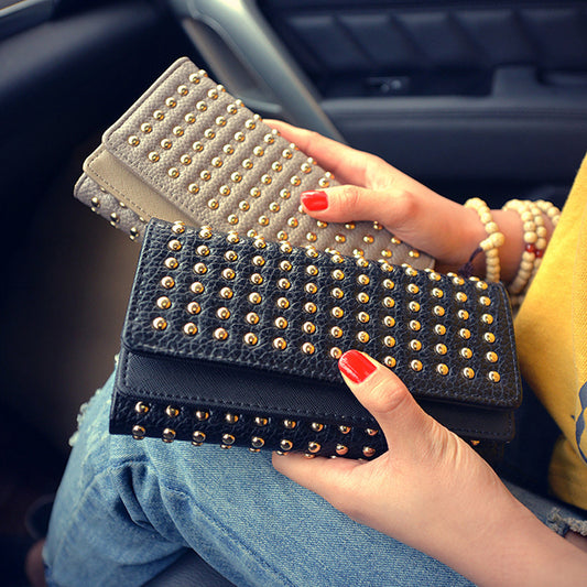 Studded wallet with flap closure