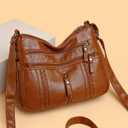 Multi-pocket shoulder bag with zipper closure
