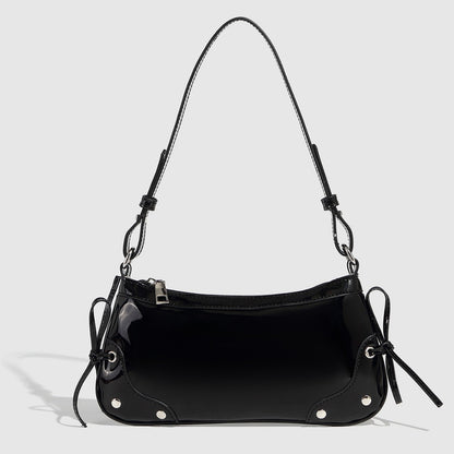 Glossy shoulder bag with side ties