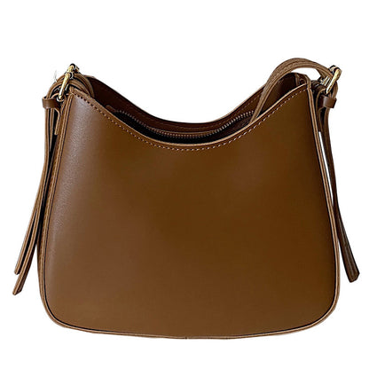 Curved shoulder bag with zipper closure