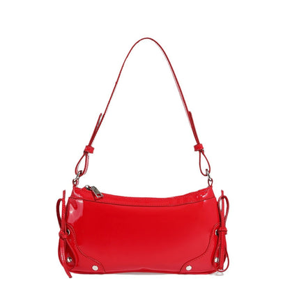 Glossy shoulder bag with side ties