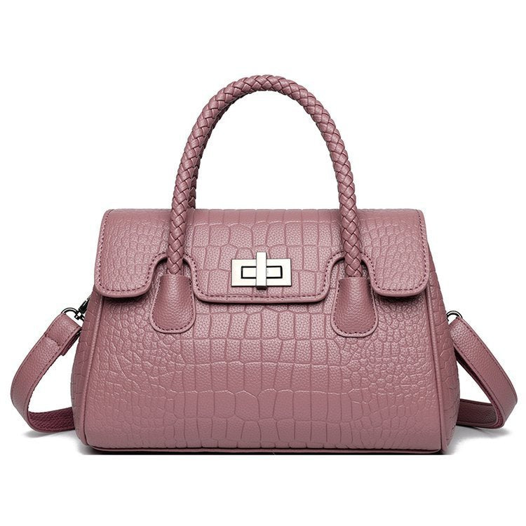 Embossed handbag with turn-lock closure