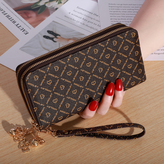 Patterned zip-around wallet with wrist strap