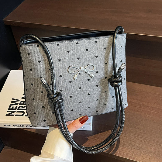 Structured handbag with perforated surface