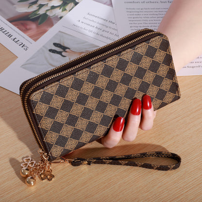 Patterned zip-around wallet with wrist strap
