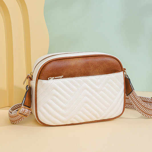Quilted crossbody bag with front pocket