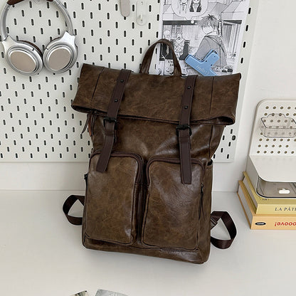 Fold-over flap backpack with front pocket