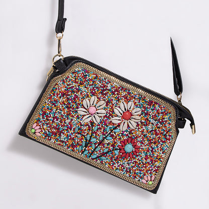Embroidered crossbody bag with embellishments
