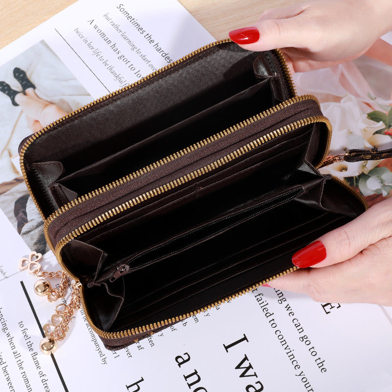 Patterned zip-around wallet with wrist strap
