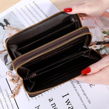 Patterned zip-around wallet with wrist strap