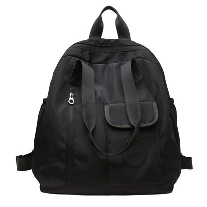 Soft backpack with flap and drawstring closure