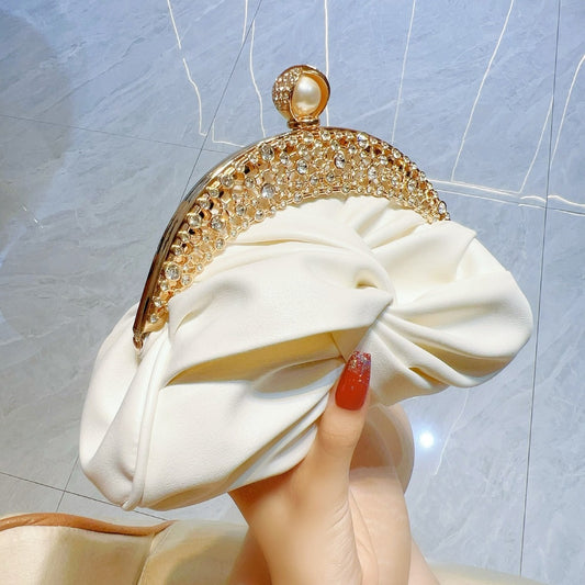 Satin clutch bag with metal frame